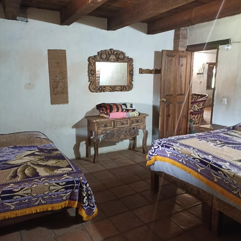 Habitación con camas matrimoniales
